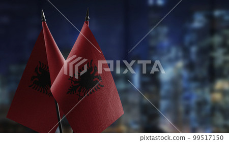 A small Albania flag on an abstract blurry background 99517150