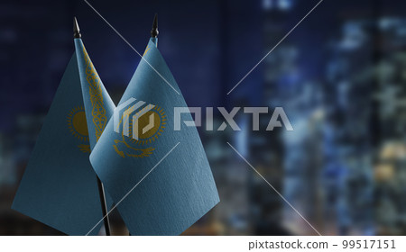 A small Kazakhstan flag on an abstract blurry background 99517151