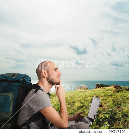 Explorer plans a new travel to a tropical beach with his laptop 99517191