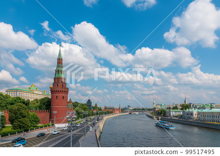 View of Kremlin with Vodovzvodnaya tower, Grand Kremlin Palace from repaired Bolshoy Kamenny Bridge in Moscow city on sunny summer day. Cruise ship sails on the Moscow river View of Kremlin with Vodovzvodnaya tower, Grand Kremlin Palace from repaired Bolshoy Kamenny Bridge in Moscow city on sunny summer day. Cruise ship sails on the Moscow river 99517495