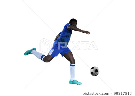Football striker with blue team suit chases the soccerball Football striker with blue team suit chases the soccerball 99517813