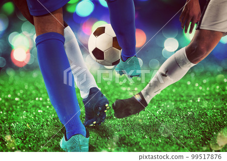 Football scene with competing soccer players at the stadium 99517876