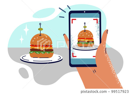 Hand with phone taking photo of hamburger on plate to share snapshot of lunch on social networks 99517923