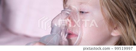 Sick girl in oxygen mask lies on hospital bed Sick girl in oxygen mask lies on hospital bed 99519997