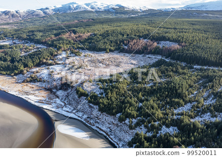Aerial view of snow covered Gweebarra River between Doochary and Lettermacaward in Donegal - Ireland - The site of the new Cloughercor wind farm in the background Aerial view of snow covered Gweebarra River between Doochary and Lettermacaward in Donegal - Ireland - The site of the new Cloughercor wind farm in the background 99520011