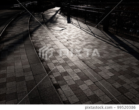 A road lined with brightly lit blocks 99520386