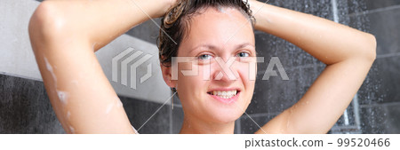 Young beautiful woman under the shower in bathroom 99520466
