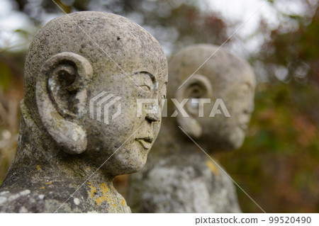 Profile of two jizo statues 99520490