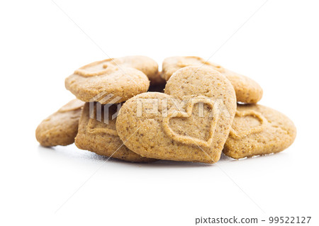 Sweet gingerbread hearts isolated on white background. Sweet gingerbread hearts isolated on white background. 99522127