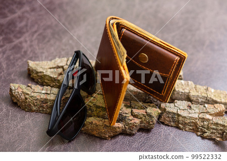 Open brown mens wallet with money and credit cards Open brown mens wallet with money and credit cards 99522332