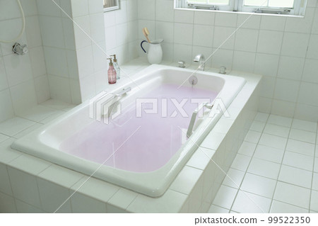 Bathroom Bathtub filled with hot water 99522350