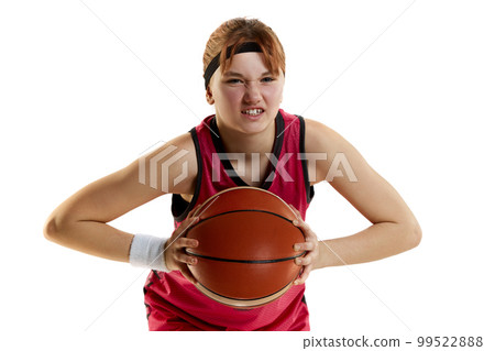 Sportive ambitions and motivation. Teen girl, basketball player posing with ball isolated over white studio background. Concept of professional sport and hobby 99522888