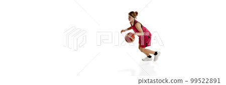 Dribbling. Teen girl, basketball player in motion, playing, training isolated over white studio background. Concept of professional sport and hobby Dribbling. Teen girl, basketball player in motion, playing, training isolated over white studio background. Concept of professional sport and hobby 99522891