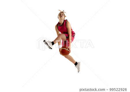 Jump shot. Teen girl, basketball player in action, jumping with ball isolated over white studio background. Concept of professional sport and hobby 99522926