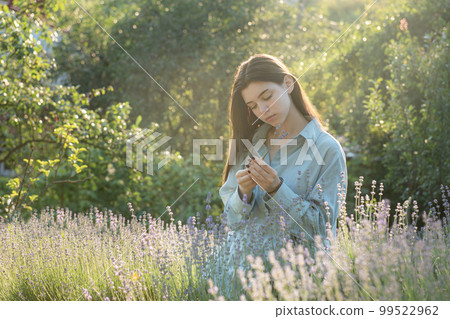 Beautiful young girl on lavender field. Beautiful young girl on lavender field. 99522962