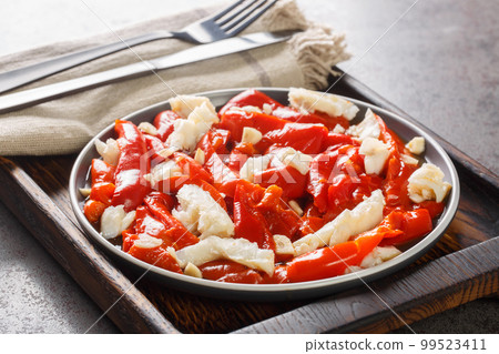 Esgarraet Red pepper and cod salad is a typical Valencian dish closeup on the plate. Horizontal 99523411