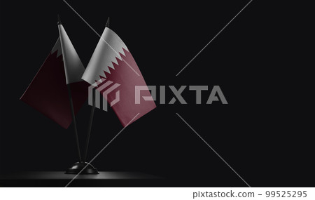 Small national flags of the Qatar on a black background 99525295