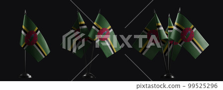 Small national flags of the Dominica on a black background 99525296
