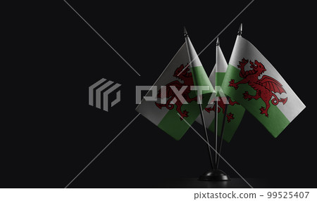 Small national flags of the Wales on a black background Small national flags of the Wales on a black background 99525407