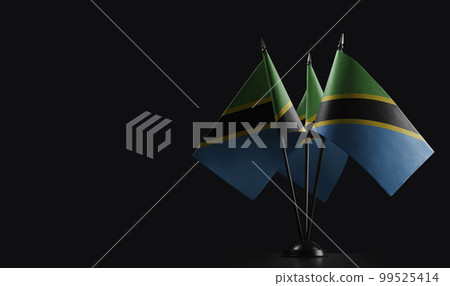 Small national flags of the Tanzania on a black background Small national flags of the Tanzania on a black background 99525414