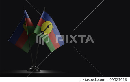 Small national flags of the New Caledonia on a black background Small national flags of the New Caledonia on a black background 99525618