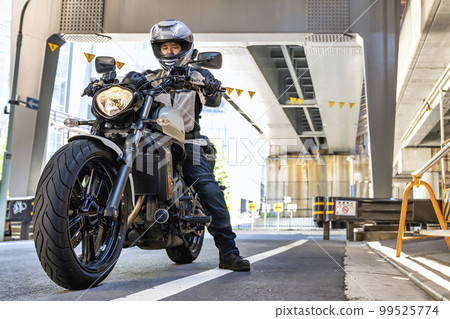 Cruiser bike and male rider Tokyo Cruiser bike and male rider Tokyo 99525774
