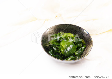 Laminaria (Kelp) Seaweed in black ceremic bowl. Japanese healthy food. Laminaria (Kelp) Seaweed in black ceremic bowl. Japanese healthy food. 99526272