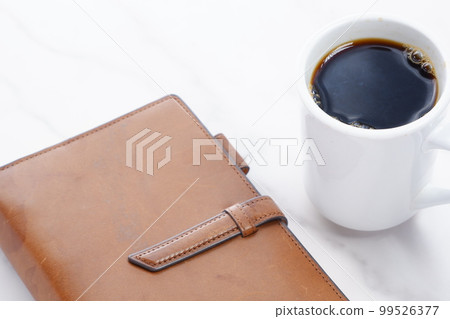 coffee and notebook 99526377