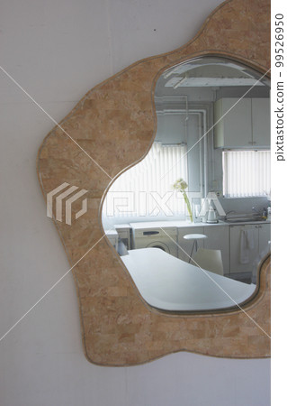 Dining kitchen in the afternoon with light reflected in the mirror Dining kitchen in the afternoon with light reflected in the mirror 99526950