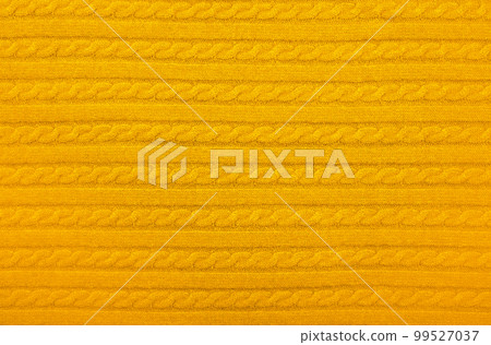 Background texture of yellow knitted wool fabric Background texture of yellow knitted wool fabric 99527037