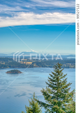 Gorgeous view of Mountain Baker over the ocean bay on blue sky background 99527122