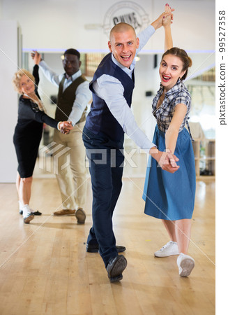 Man and woman learning to dance classical ballroom dance Man and woman learning to dance classical ballroom dance 99527358
