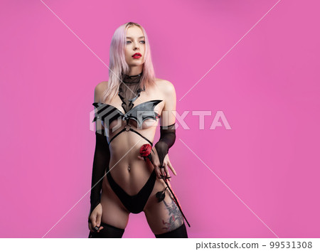 Sexy girl in sex shop underwear bodysuit for bodysuit games on pink bright background copy paste 99531308