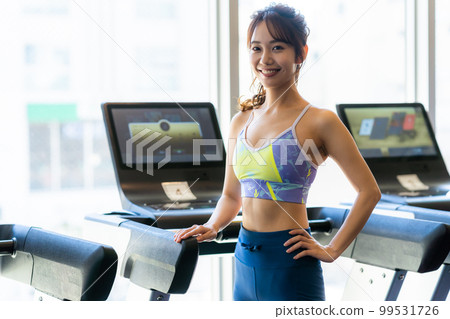 Young woman training in a sports gym Young woman training in a sports gym 99531726