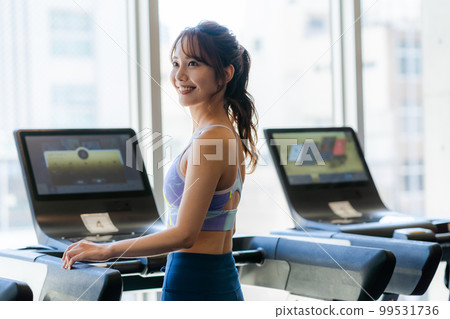 Young woman training in a sports gym Young woman training in a sports gym 99531736