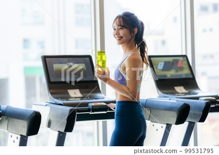 Young woman training in a sports gym Young woman training in a sports gym 99531795