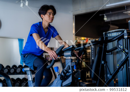 Young man training in the gym 99531812