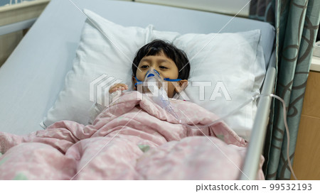Sick boy inhalation therapy by the mask of inhaler. Sick boy inhalation therapy by the mask of inhaler. 99532193