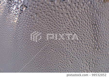 Lots of tiny water drops on a plastic bottle Lots of tiny water drops on a plastic bottle 99532852