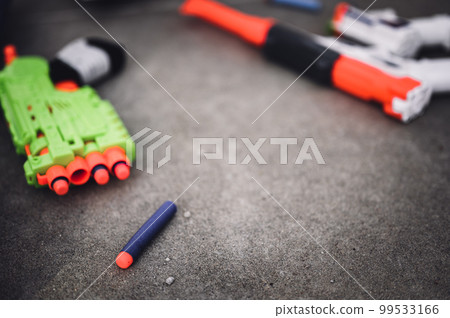 Soft foam dart gun loaded and ready for use by children. 99533166