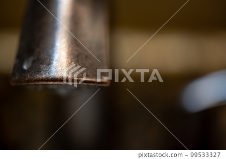 selective focus on the front lip of a bathroom faucet selective focus on the front lip of a bathroom faucet 99533327
