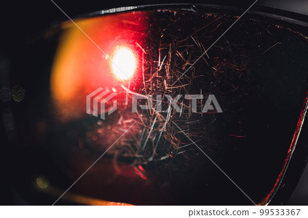 macro of the scratched surface of a polarized sunglasses lens macro of the scratched surface of a polarized sunglasses lens 99533367