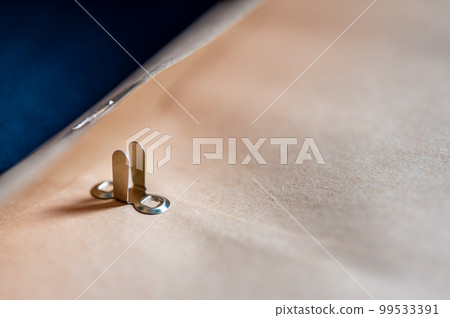 manilla envelope with reinforced hole and metal folding clasp. manilla envelope with reinforced hole and metal folding clasp. 99533391