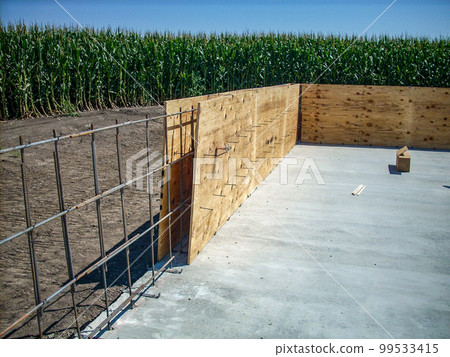 Rebar steel and plywood forms ready for concrete pour Rebar steel and plywood forms ready for concrete pour 99533415