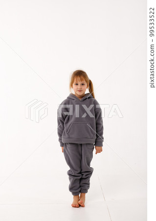 Little girl in thermal clothes, on a white background. 99533522