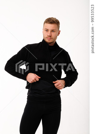 A man with a sporty physique in thermal underwear. A man with a sporty physique in thermal underwear. 99533523