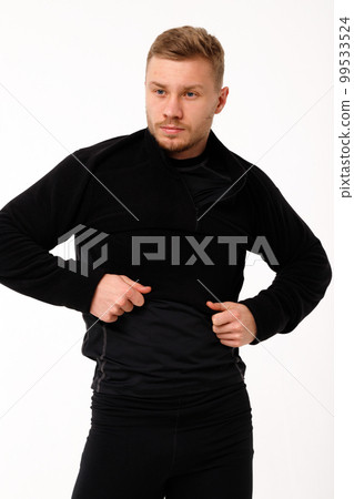 A man with a sporty physique in thermal underwear. A man with a sporty physique in thermal underwear. 99533524