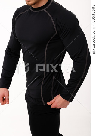 A man with a sporty physique in thermal underwear. A man with a sporty physique in thermal underwear. 99533593