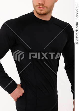 A man with a sporty physique in thermal underwear. A man with a sporty physique in thermal underwear. 99533909