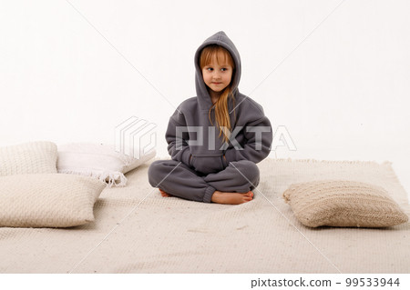Little girl in thermal clothes, on a white background. 99533944